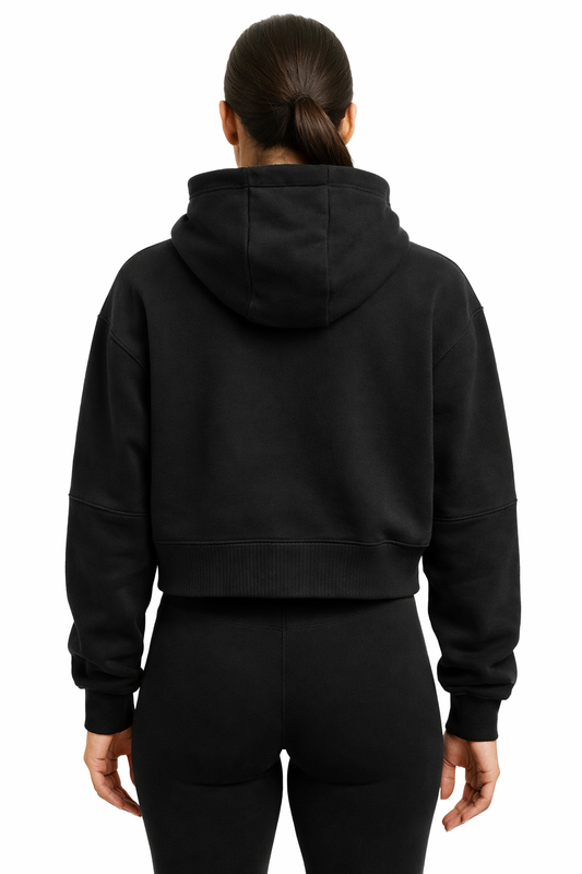 Person wearing a black hoodie from behind on a white background