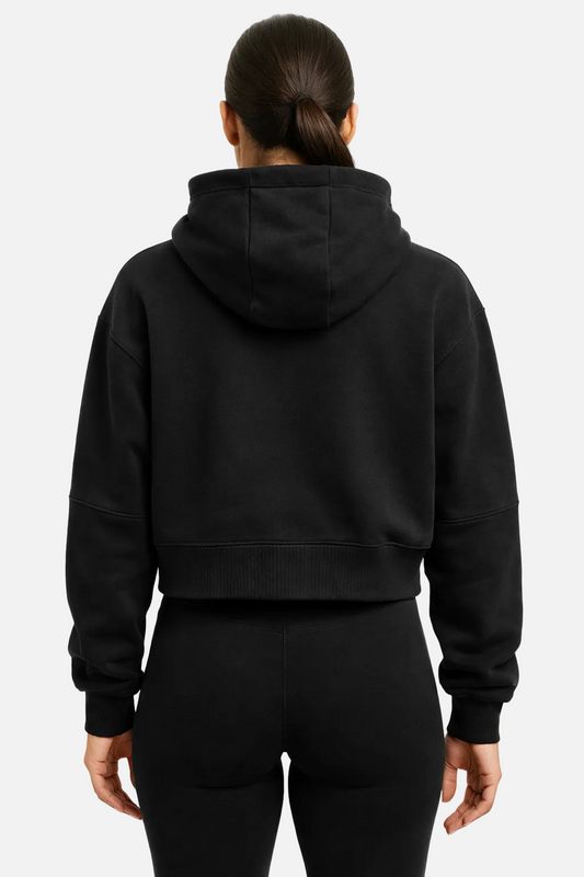 Person wearing a black hoodie from behind on a white background