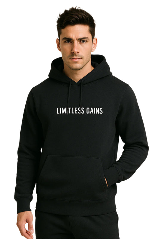 Person wearing a black hoodie with 'Limitless Gains' text on a white background