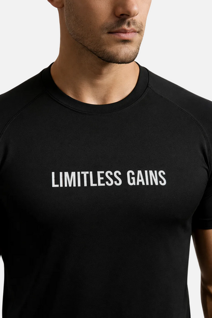 Black t-shirt with 'LIMITLESS GAINS' text worn by a person on a white background