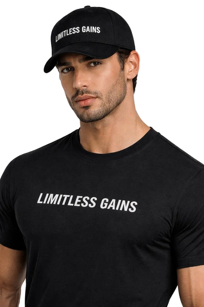 Man wearing a black cap and t-shirt with 'Limitless Gains' text on a white background