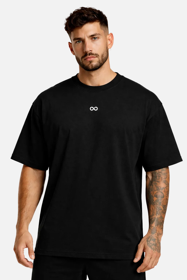 Man wearing a black t-shirt with a LIMITLESS GAINS logo on a white background
