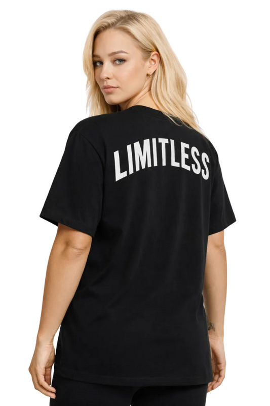 Person wearing a black t-shirt with 'LIMITLESS' printed on the back against a white background