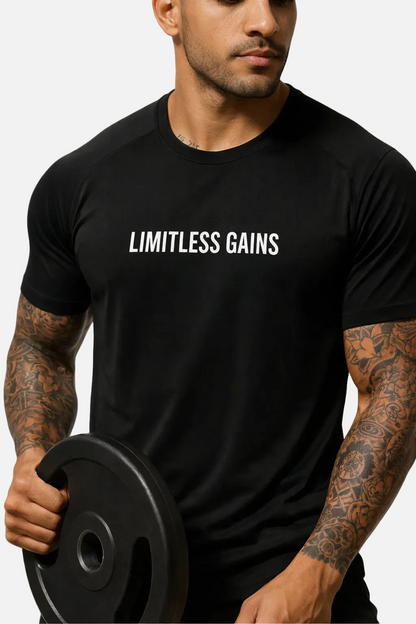 Man wearing a black 'LIMITLESS GAINS' t-shirt holding a barbell.