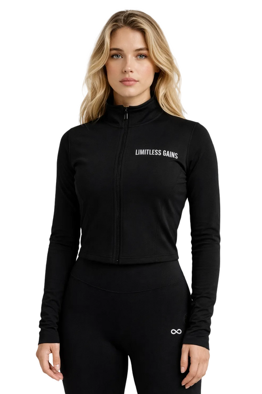 Woman wearing a black jacket with 'Limitless Gains' logo on a white background