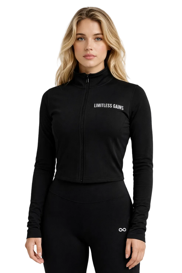 Woman wearing a black jacket with 'Limitless Gains' logo on a white background