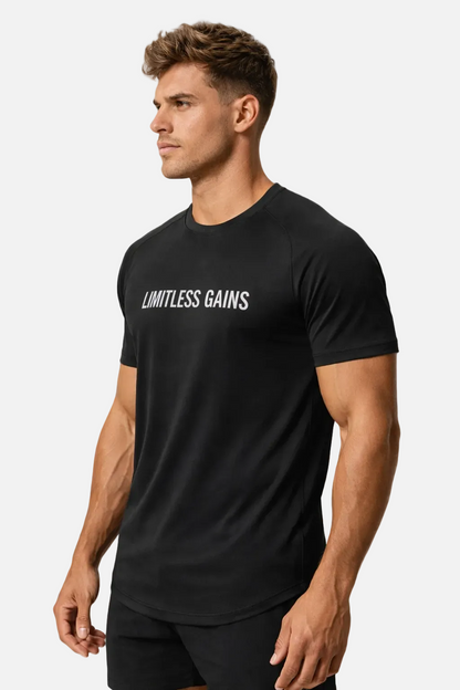 Man wearing a black t-shirt with 'Limitless Gains' text on a white background