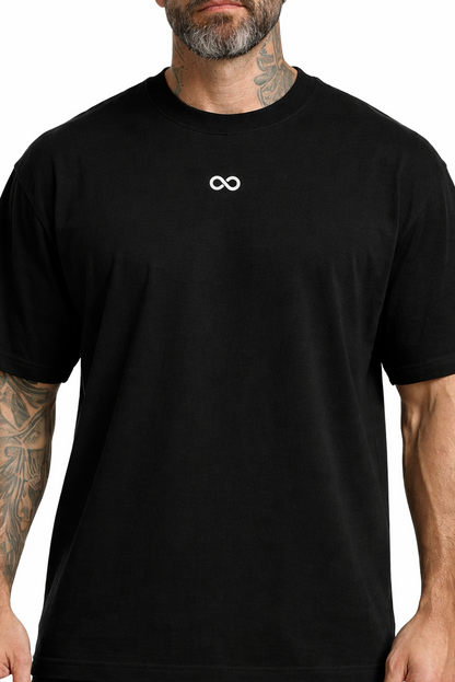 Black t-shirt with a white LIMITLESS GAINS logo worn by a person on a white background