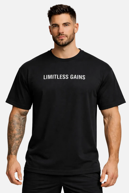 Man wearing a black t-shirt with 'LIMITLESS GAINS' text on a white background