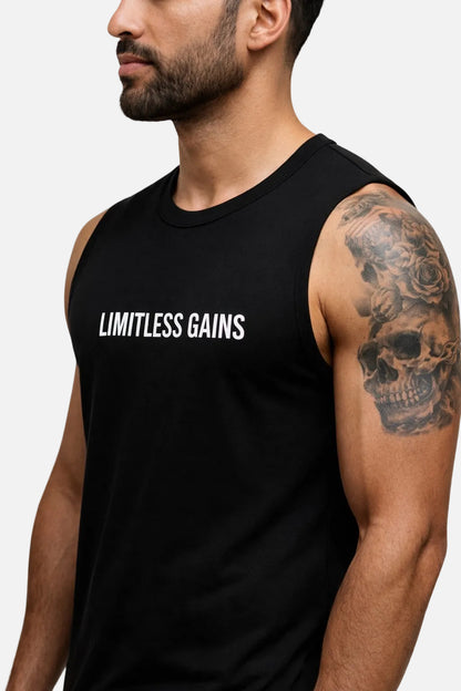 Man wearing a black tank top with 'LIMITLESS GAINS' text on a white background